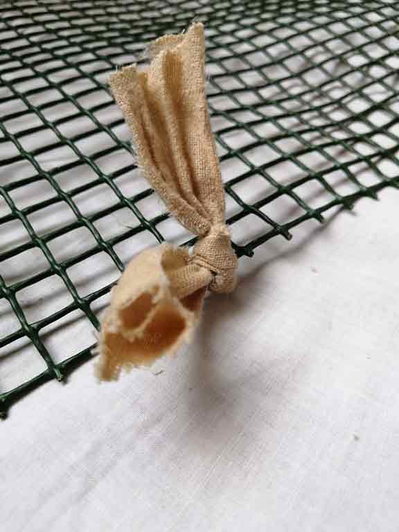 Dog Snuffle Mats - 5 Reasons Why You Need One + Easy DIY Instructions 8 Dog Snuffle Mat - Knot Fabric Strips To Grid