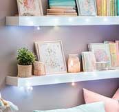 Recreate The Look - Cozy Corner Reading Nook For Girls 28 Plants and candles displayed on a shelf