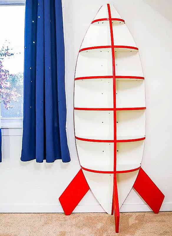 15+ DIY Kids Bookshelf Ideas (With Tutorials) 14 Kids rocket ship bookshelf DIY